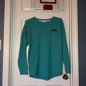 Blue sweatshirt with black words